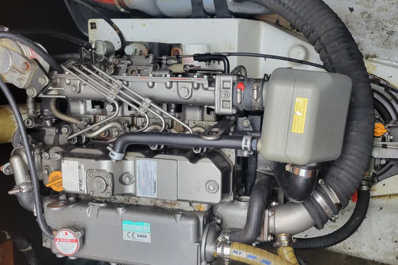 Slide: The Image of Engine of a 2011 Lagoon 450 catamaran, showcasing intricate mechanical components. - 46