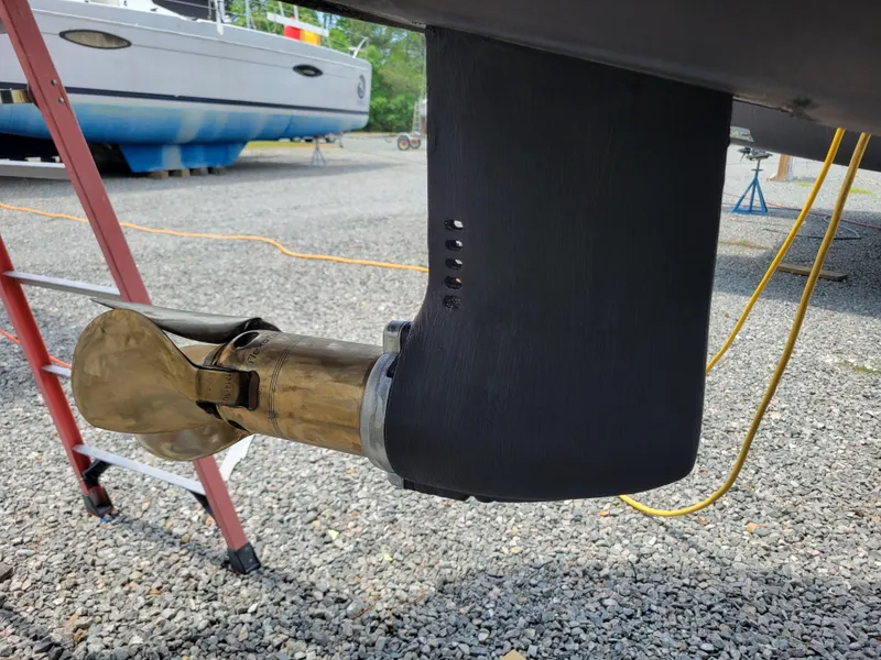 Slide: The Image of Propeller and rudder of a 2011 Lagoon 450 catamaran on dry dock. - 48