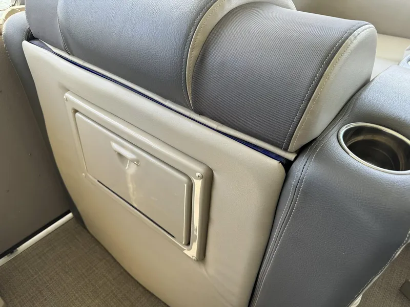 Slide: The Image of 2015 Premier 270 Grand Isle SL boat seat with cup holder and storage compartment. - 14