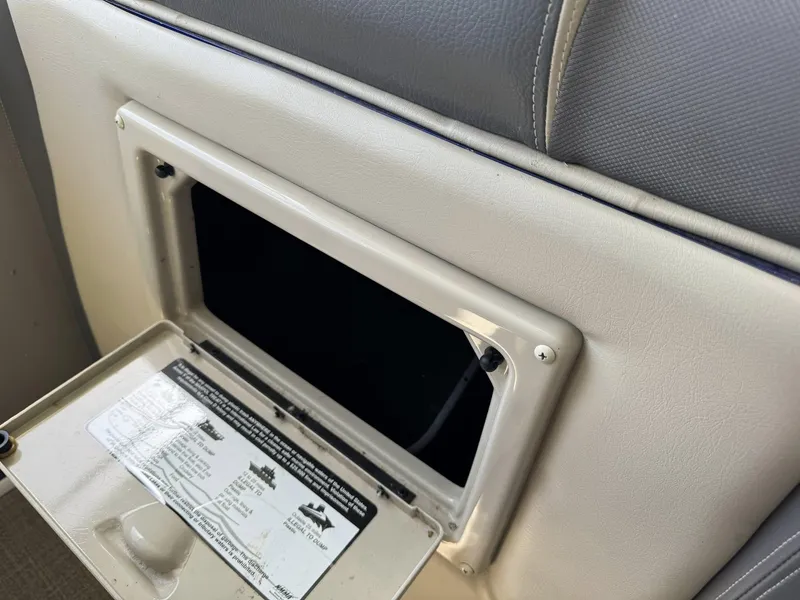 Slide: The Image of Open storage compartment in 2015 Premier 270 Grand Isle SL boat seat. - 4