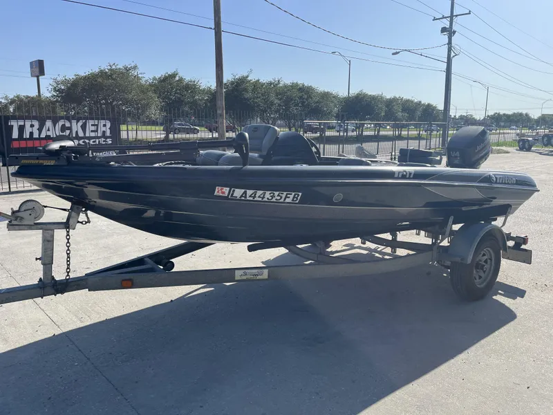 Slide: The Image of 1998 Triton Tr-17 boat on trailer, parked outdoors in sunny weather. - 3