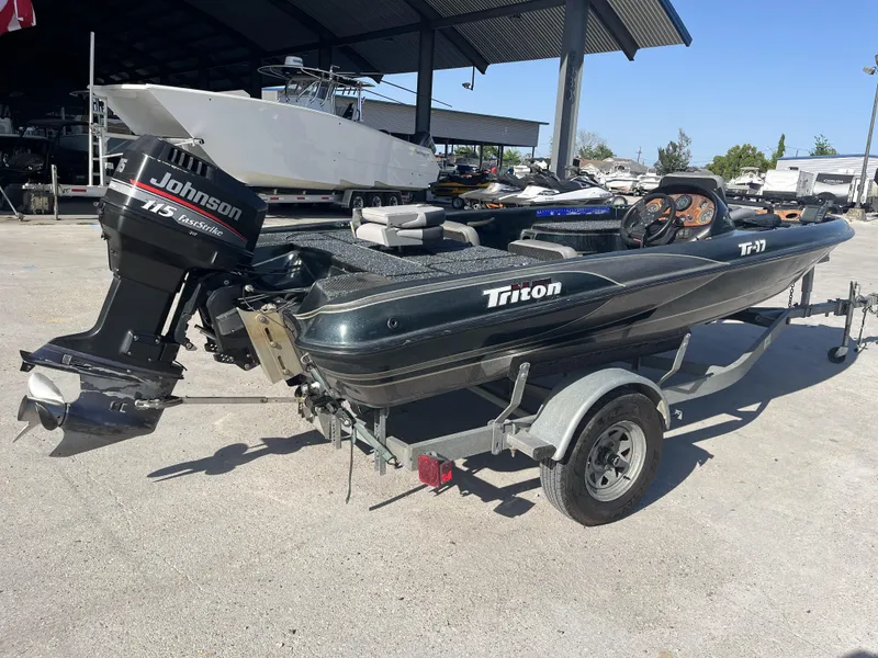 Slide: The Image of 1998 Triton Tr-17 boat with Johnson 115 FastStrike engine on trailer. - 5