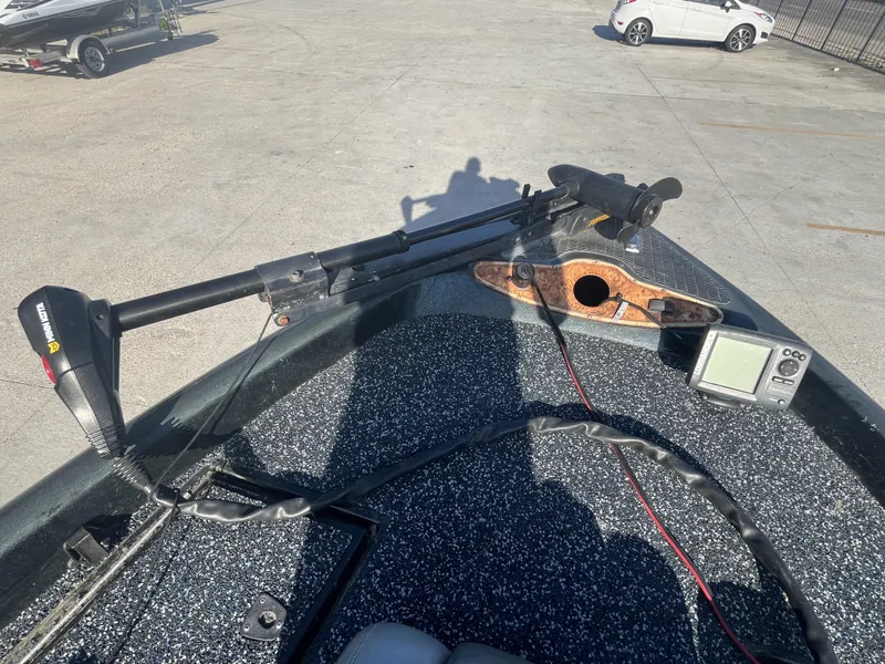 Slide: The Image of 1998 Triton Tr-17 boat deck with trolling motor and fish finder. - 7