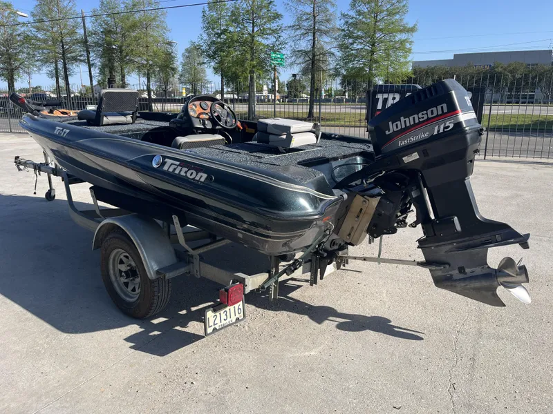 Slide: The Image of 1998 Triton Tr-17 boat with Johnson FastStrike 115 engine on a trailer. - 9