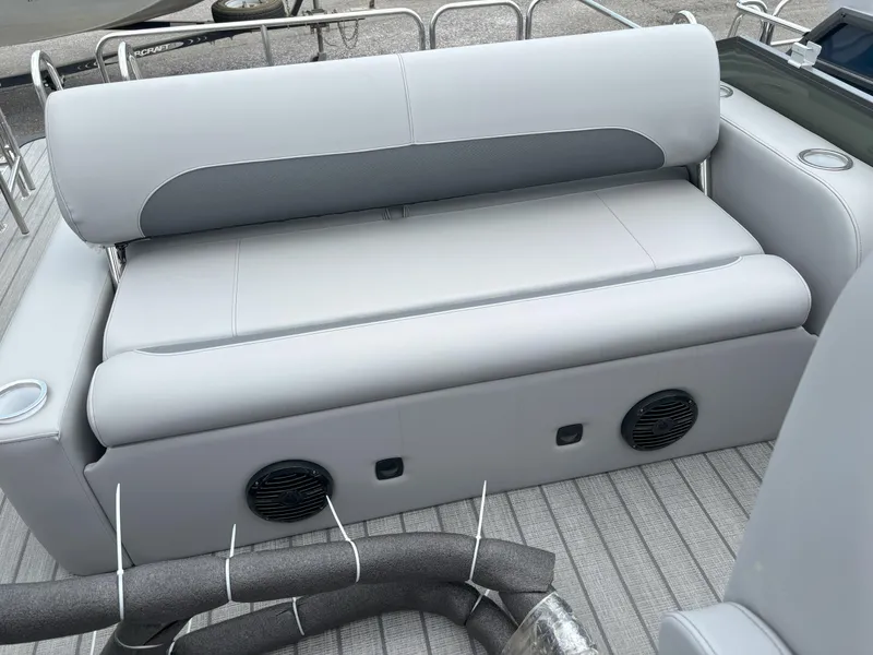 Slide: The Image of 2025 Bentley Pontoons Legacy 223 Swingback interior seating with speakers and cup holders. - 11