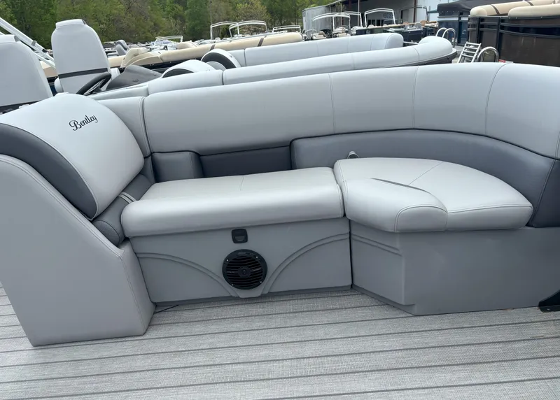 Slide: The Image of 2025 Bentley Pontoons Legacy 223 Swingback interior seating, featuring luxurious gray upholstery. - 20