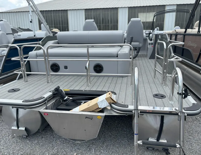 Slide: The Image of 2025 Bentley Pontoons Legacy 223 Swingback, rear view with seating and deck details. - 23