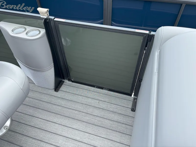 Slide: The Image of 2025 Bentley Pontoons Legacy 223 Swingback interior with seating and cup holders. - 7
