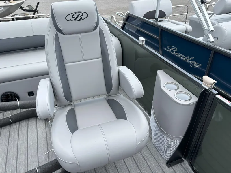 Slide: The Image of 2025 Bentley Pontoons Legacy 223 Swingback interior with luxurious seating and cup holders. - 8
