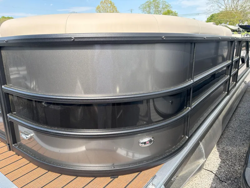 Slide: The Image of 2025 Bentley Pontoons Legacy 223 Swingback, sleek design, gray exterior, close-up view. - 1
