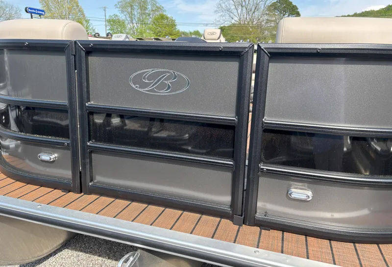 Slide: The Image of 2025 Bentley Pontoons Legacy 223 Swingback, sleek design with logo, outdoor setting. - 12