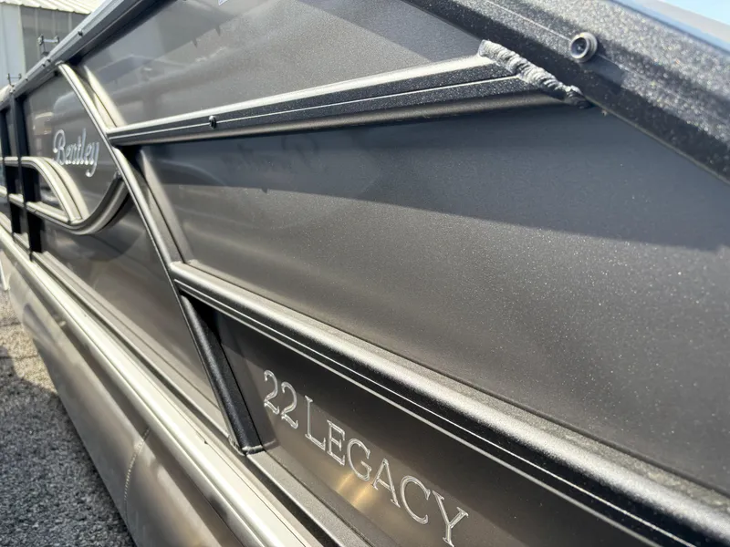 Slide: The Image of 2025 Bentley Pontoons Legacy 223 Swingback, sleek design with "22 Legacy" branding. - 13