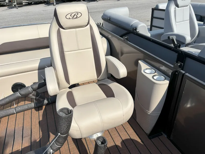 Slide: The Image of 2025 Bentley Pontoons Legacy 223 Swingback interior with luxurious seating and cup holders. - 16