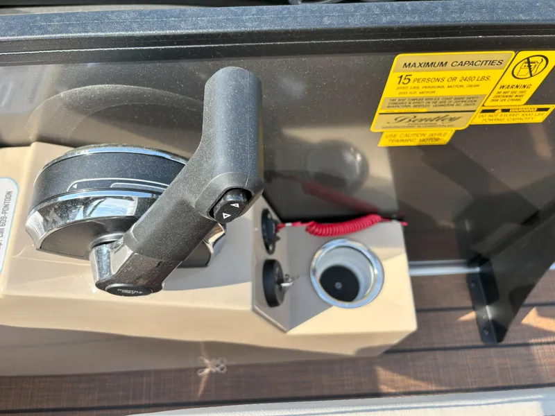 Slide: The Image of Control panel of 2025 Bentley Pontoons Legacy 223 Swingback with capacity warning label. - 17