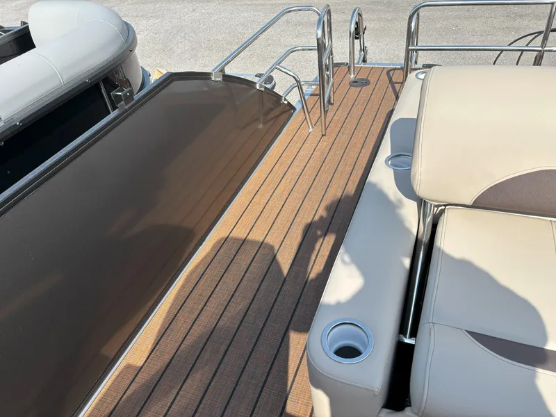 Slide: The Image of 2025 Bentley Pontoons Legacy 223 Swingback deck with seating and cup holders. - 20