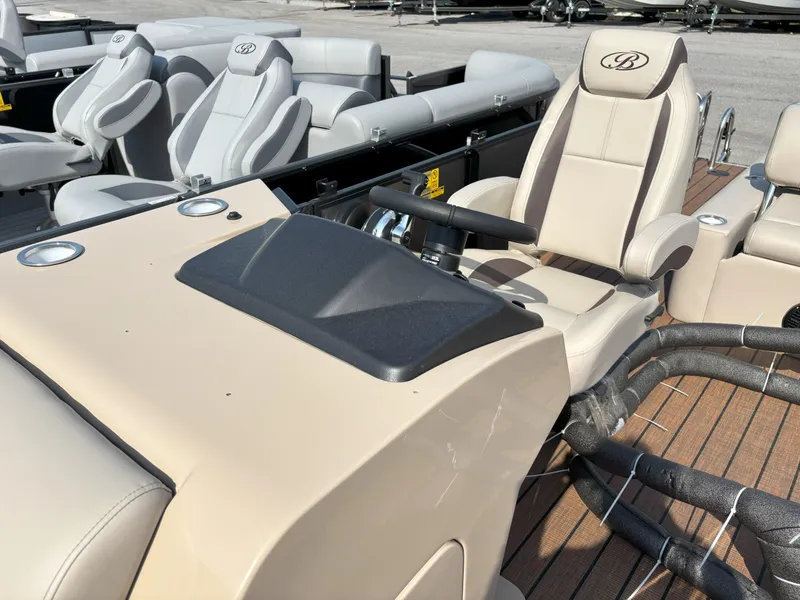 Slide: The Image of 2025 Bentley Pontoons Legacy 223 Swingback interior with beige and gray seating. - 7