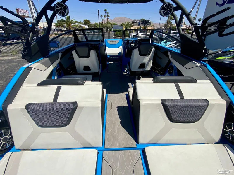 Slide: The Image of 2023 Yamaha Boats 222XE interior with modern seating and sleek design. - 6