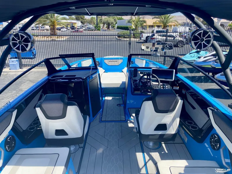 Slide: The Image of 2023 Yamaha Boats 222XE interior with modern seating and advanced dashboard features. - 7