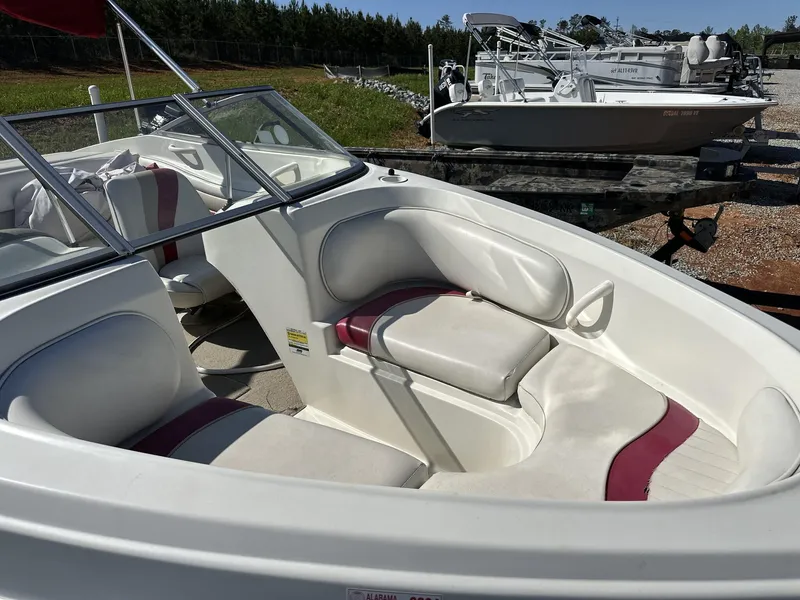 Slide: The Image of 2007 Caravelle 182 186 MODEL boat interior with white and maroon seating. - 3