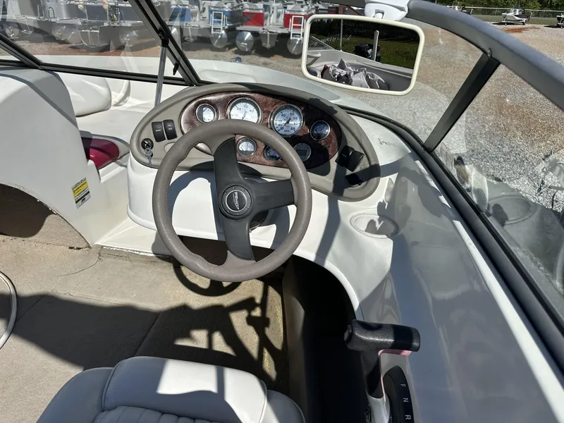 Slide: The Image of Interior view of a 2007 Caravelle 182 186 MODEL boat cockpit with steering wheel and gauges. - 7