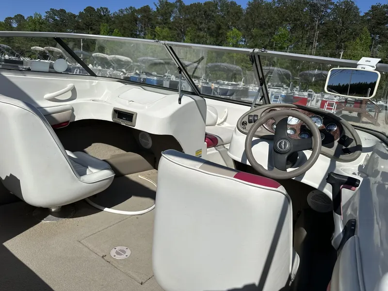 Slide: The Image of Interior of a 2007 Caravelle 182 186 MODEL boat with steering wheel and seating. - 8