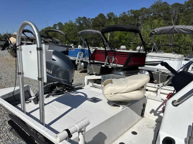 Slide: The Image of 2022 G3 Bay 17 BAY boat with Yamaha motor, parked among other boats. - 11