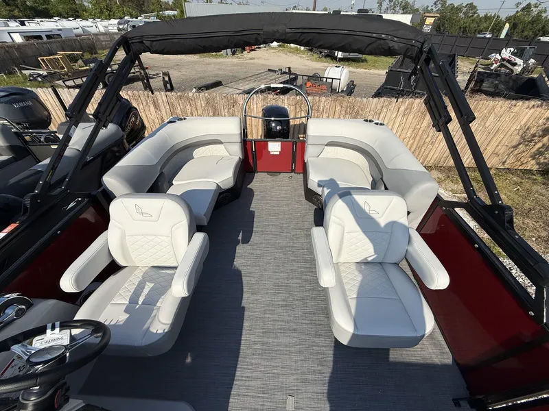 Slide: The Image of 2025 Lowe SS230 pontoon boat interior with plush seating and modern design. - 5