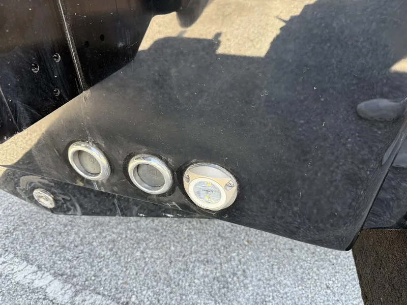 Slide: The Image of Close-up of 2025 Tidewater 2410 Bay Max boat hull with underwater lights. - 8