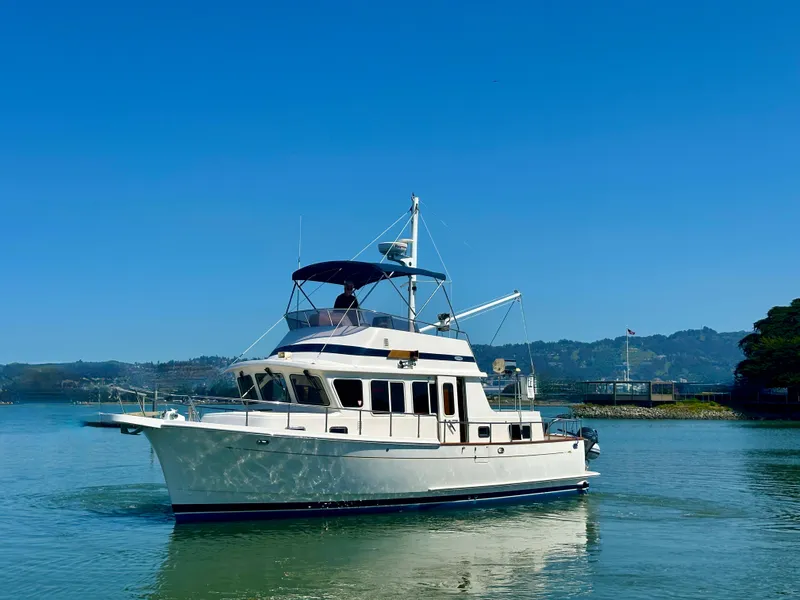 Slide: The Image of 2006 Selene Archer 36 yacht cruising on calm waters under clear blue skies. - 0