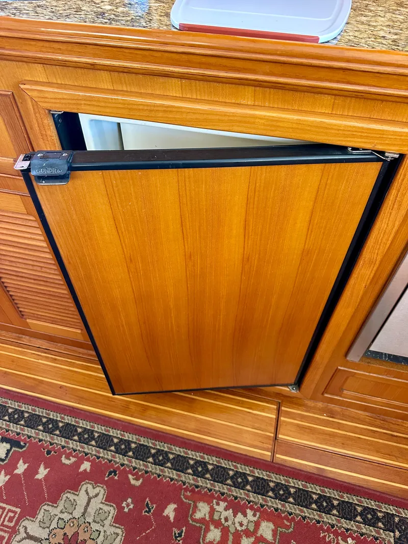 Slide: The Image of Wooden cabinet with open door on Selene Archer 36, 2006 model. - 16
