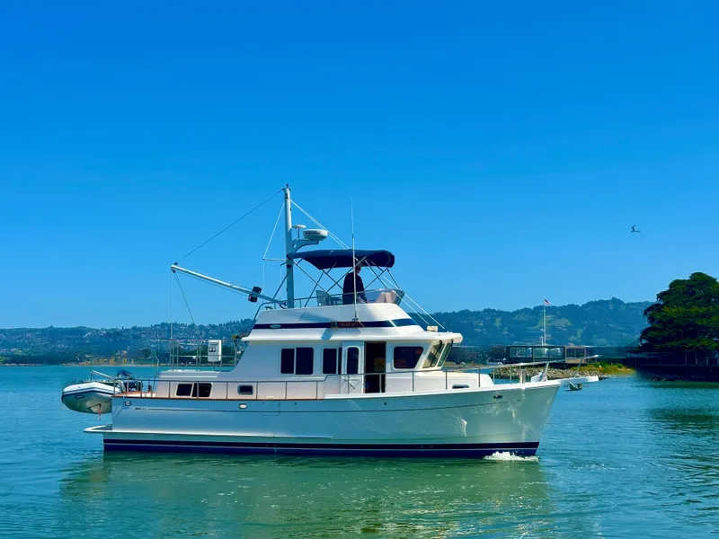 Slide: The Image of Selene Archer 36 yacht from 2006 on calm water with scenic background. - 2