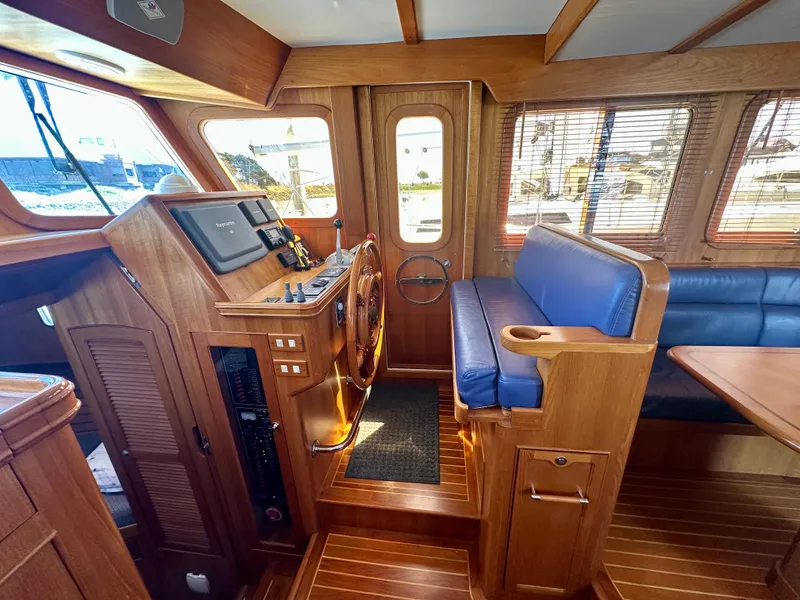 Slide: The Image of Interior of 2006 Selene Archer 36 yacht with wooden finish and blue seating. - 20