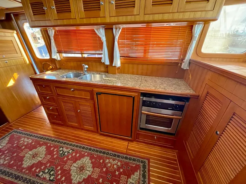 Slide: The Image of Luxurious wooden kitchen interior of 2006 Selene Archer 36 yacht with granite countertop. - 28