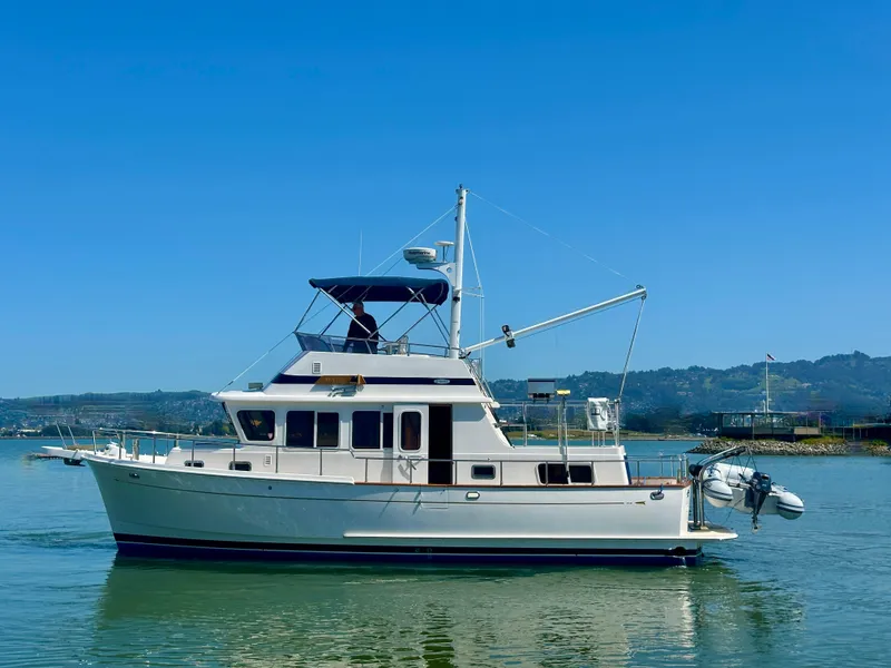 Slide: The Image of 2006 Selene Archer 36 yacht cruising on calm waters under clear blue skies. - 3