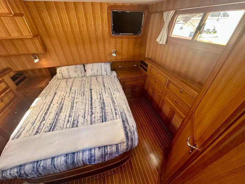 Slide: The Image of Cozy cabin interior of 2006 Selene Archer 36 yacht with wood paneling and bed. - 32