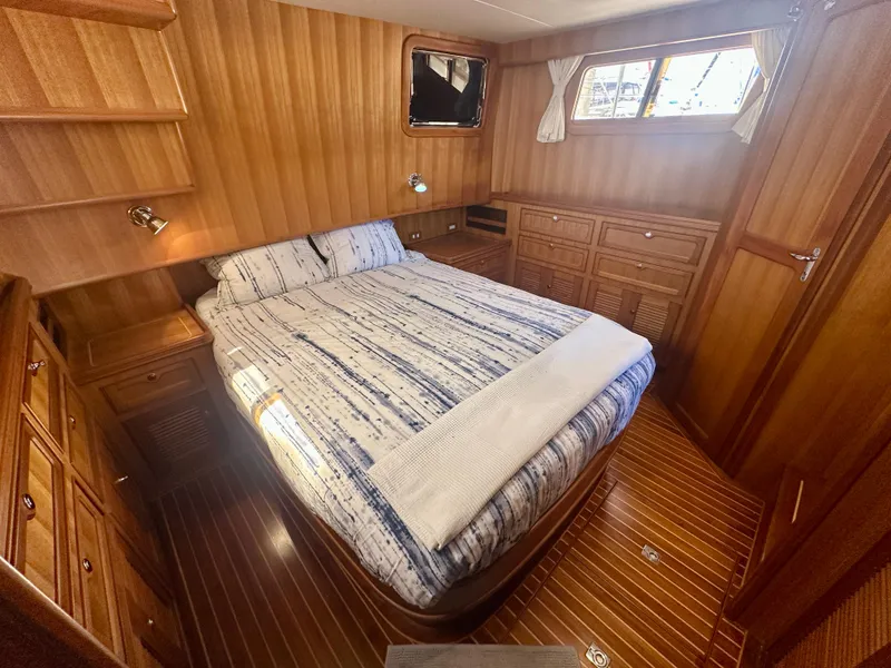 Slide: The Image of Luxurious 2006 Selene Archer 36 yacht cabin with wood paneling and cozy bed. - 34