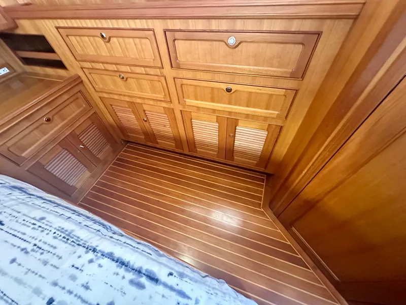 Slide: The Image of Wooden interior of 2006 Selene Archer 36 yacht, featuring cabinets and striped flooring. - 35