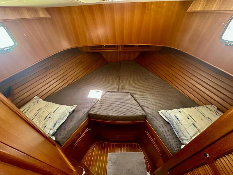 Slide: The Image of Cozy cabin interior of 2006 Selene Archer 36 yacht with wooden finish and cushions. - 40
