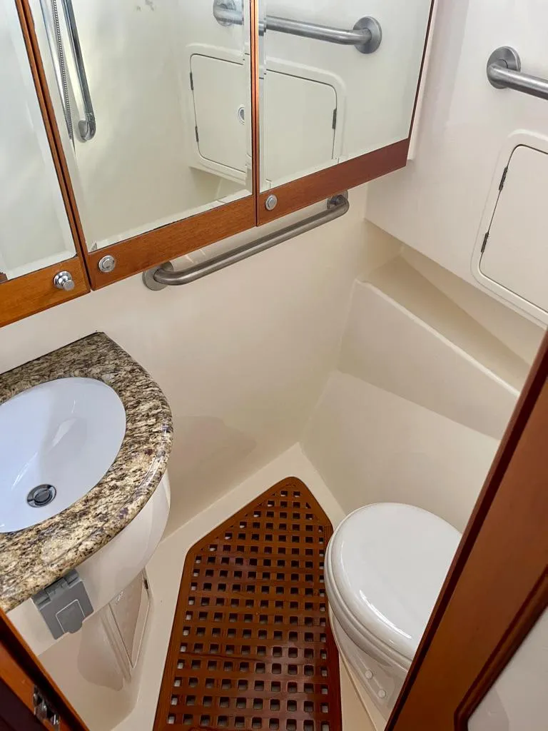 Slide: The Image of Compact bathroom in 2006 Selene Archer 36 yacht with granite countertop and wooden accents. - 42