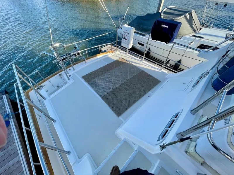 Slide: The Image of Spacious deck of 2006 Selene Archer 36 yacht docked by the water. - 45