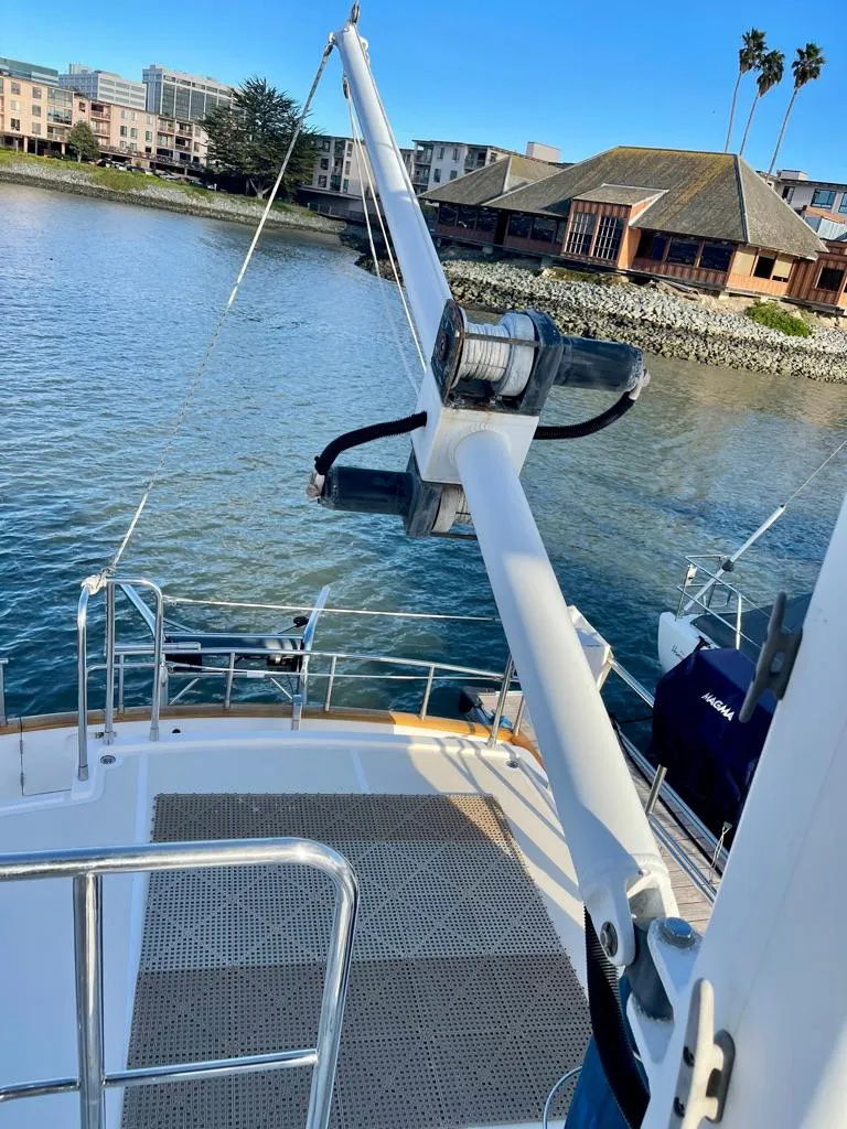 Slide: The Image of Selene Archer 36 yacht deck with davit, docked by waterfront buildings, 2006 model. - 46