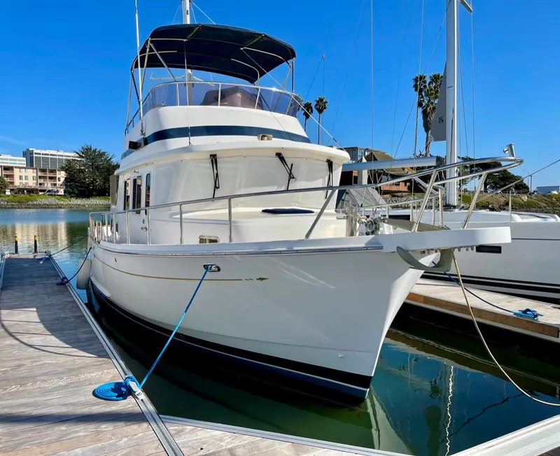 Slide: The Image of 2006 Selene Archer 36 yacht docked in a marina under clear blue skies. - 49