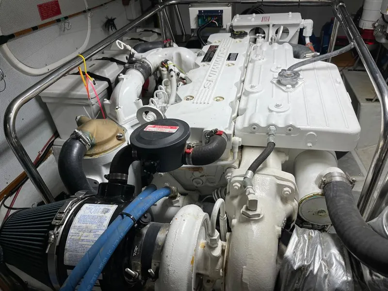 Slide: The Image of Engine room of a 2006 Selene Archer 36 yacht, showcasing a well-maintained marine engine. - 56