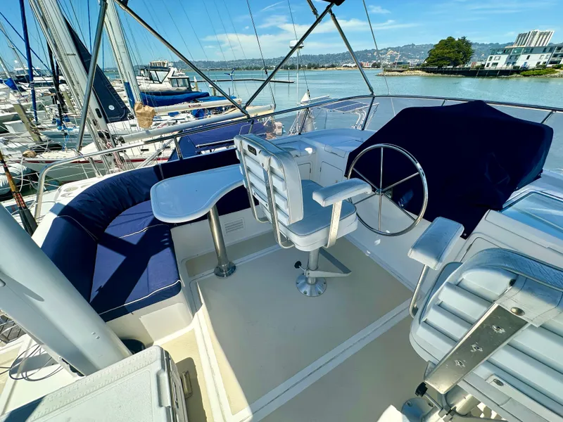 Slide: The Image of Cockpit of 2006 Selene Archer 36 yacht with seating and steering wheel, docked at marina. - 7