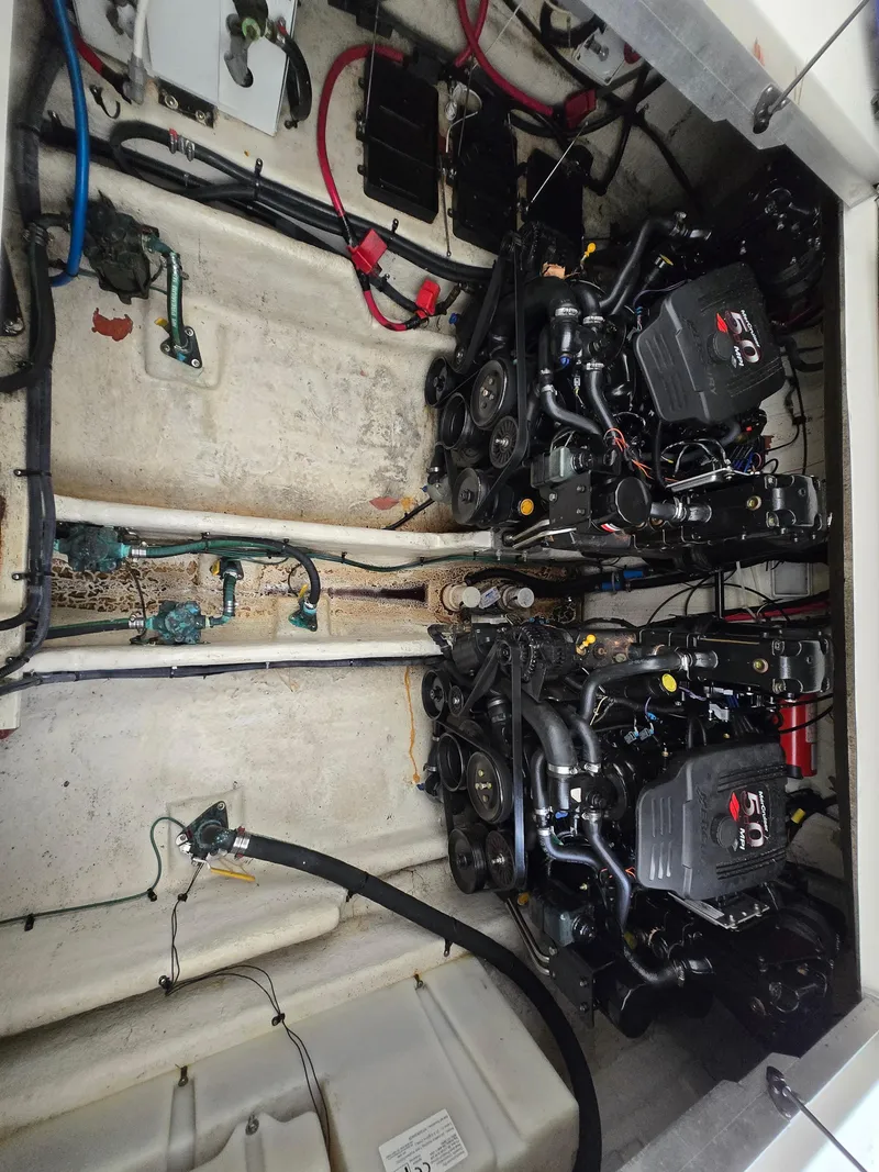 Slide: The Image of Engine compartment of 2005 Sea Ray 290 Amberjack with dual engines and wiring. - 20