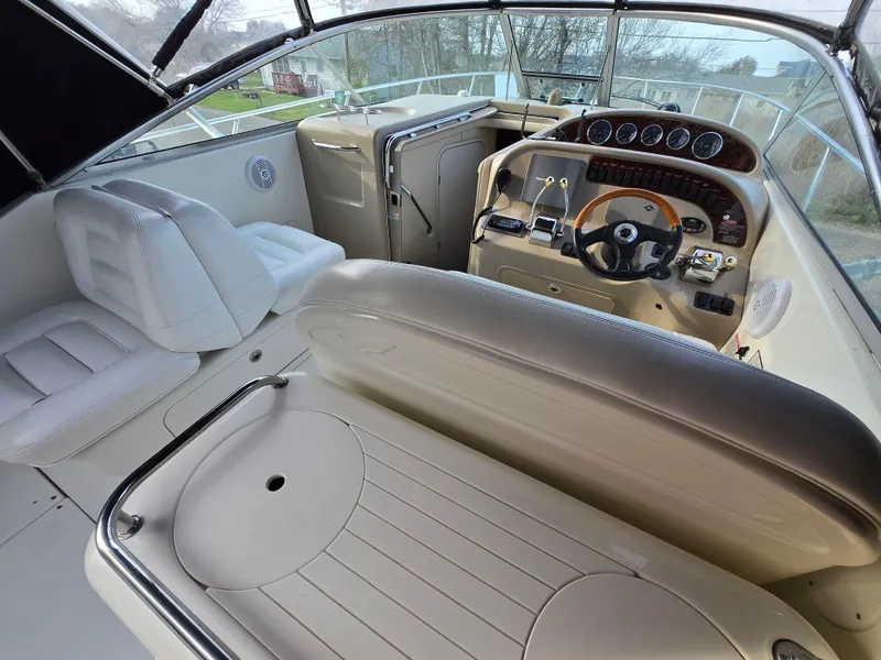 Slide: The Image of 2005 Sea Ray 290 Amberjack boat interior with helm, seating, and dashboard. - 42