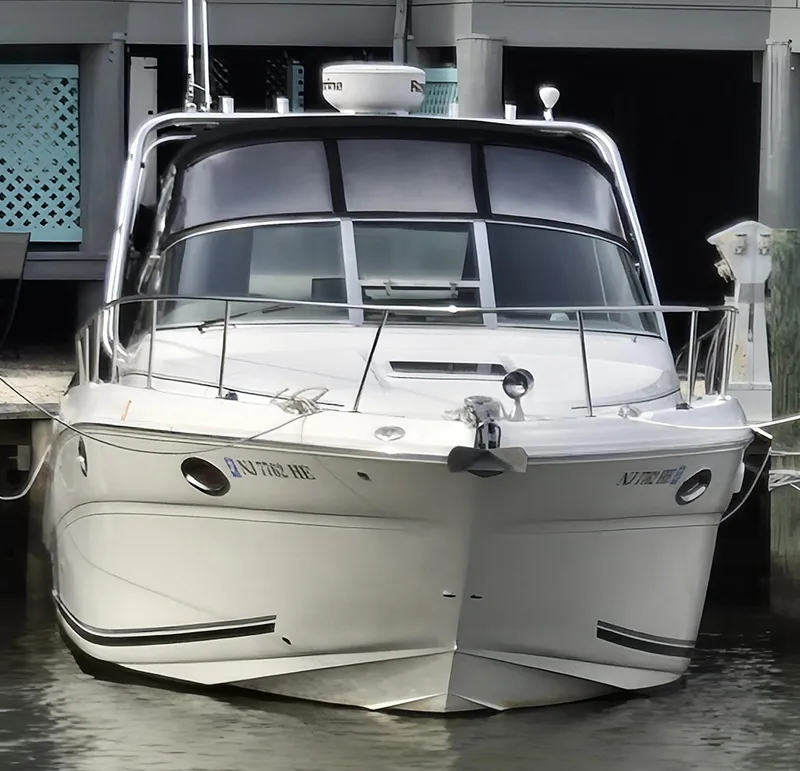 Slide: The Image of 2005 Sea Ray 290 Amberjack boat docked at marina, front view. - 6