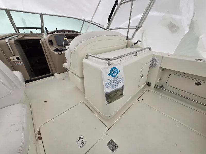 Slide: The Image of 2005 Sea Ray 290 Amberjack boat interior with helm and seating area. - 8