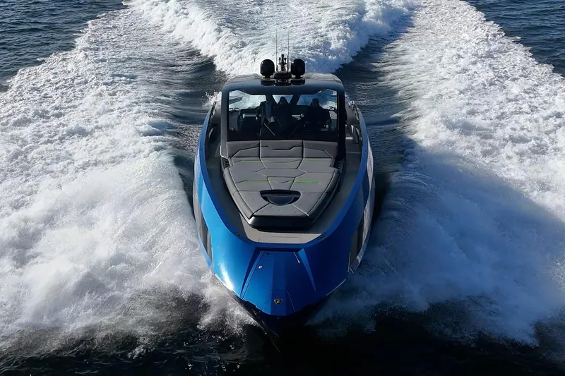 Slide: The Image of 2023 Tecnomar Lamborghini 63 yacht cruising on open water, showcasing sleek design and powerful performance. - 10