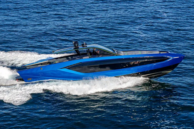 Slide: The Image of 2023 Tecnomar Lamborghini 63 yacht cruising on open water, showcasing sleek design and luxury. - 12